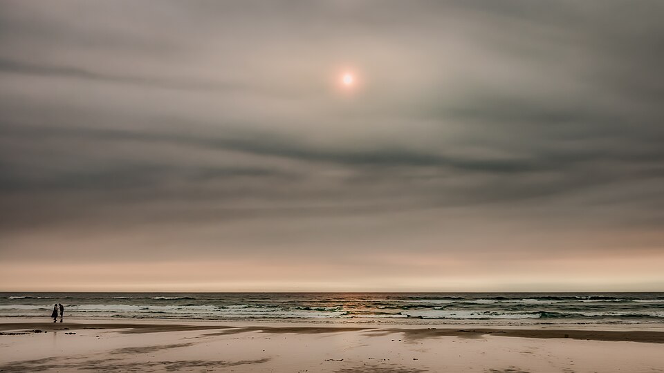 Sunset over the wide beach at Cannon Beach, Oregon
